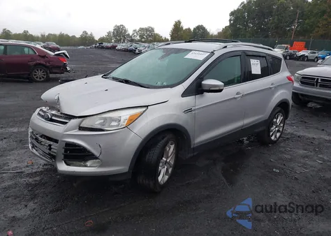 2016 Ford Escape Titanium z USA, uszkodzony, nr VIN 1FMCU9J92GUC33797